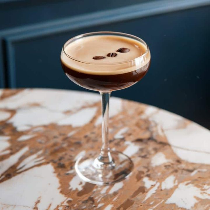 espresso martini cocktail on a marble table